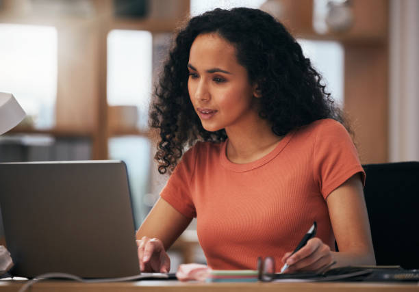istock Laptop, reading and professional woman writing summary notes, schedule or event planner planning online business calendar. Computer, secretary and receptionist check company agenda, journal or report 1704176248