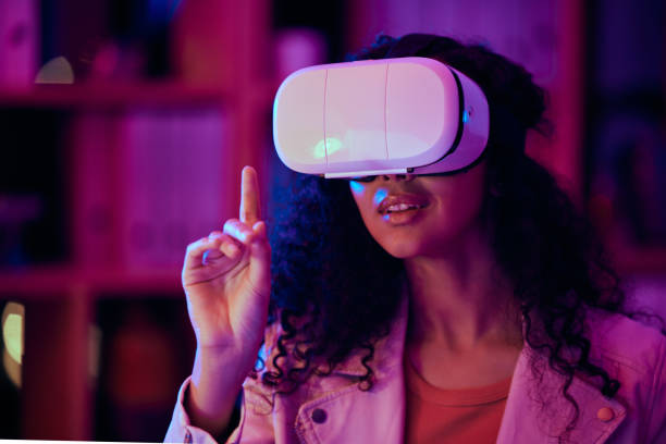 istock Woman, hand and virtual reality, press on screen with digital world and 3D, future technology and neon lighting. Experience, VR and metaverse, scifi or fantasy with simulation, gaming and holographic 1704176265