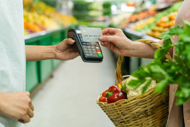 istock Customer making a contactless payment at the supermarket 1704180303