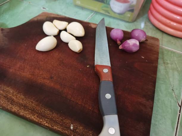 istock garlic and shallots on a cutting board, right side view 1704192851