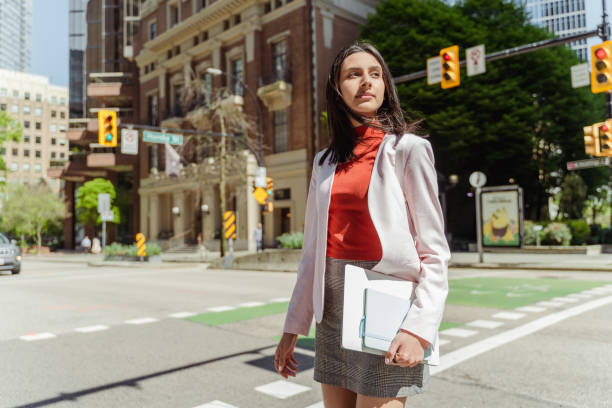 istock Confident Indian student girl wearing stylish clothes, holding laptop computer 1704211027