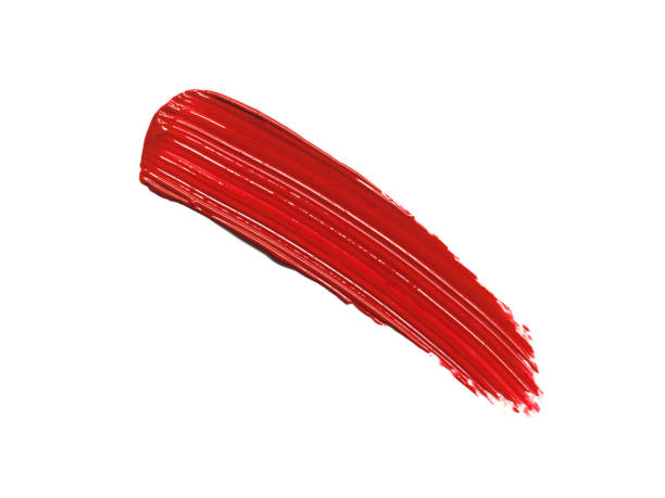 istock Red lipstick glossy texture, texture stroke isolated on white background. Cosmetic product swatch 1704218133