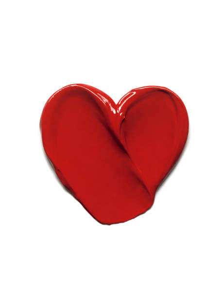 istock Red lipstick glossy texture in heart shape, texture stroke isolated on white background. Cosmetic product swatch 1704218137