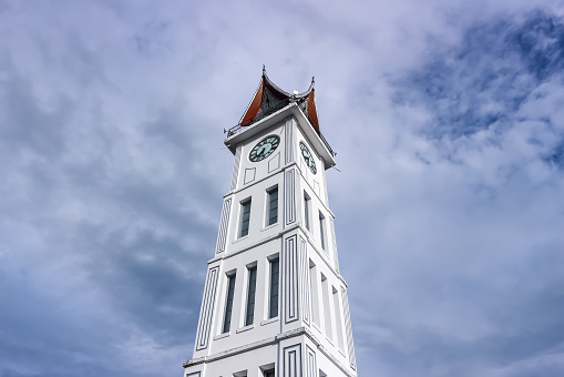 Bukittinggi,West Sumatra-Indonesia,June 12,2023: Jam Gadang or Gadang Clock is a clock tower which is a marker or icon of the city of Bukittinggi,West Sumatra,Indonesia. Jam Gadang seen from below.
