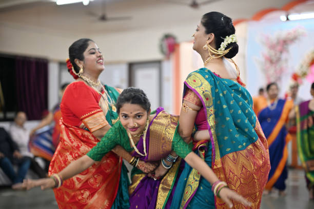 istock Group of women gracefully dancing during  Mangala Gaur celebration 1704233734