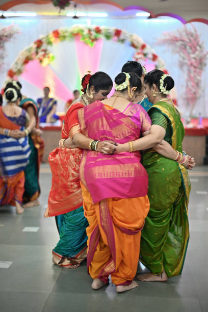 istock Group of women gracefully dancing during  Mangala Gaur celebration 1704234251