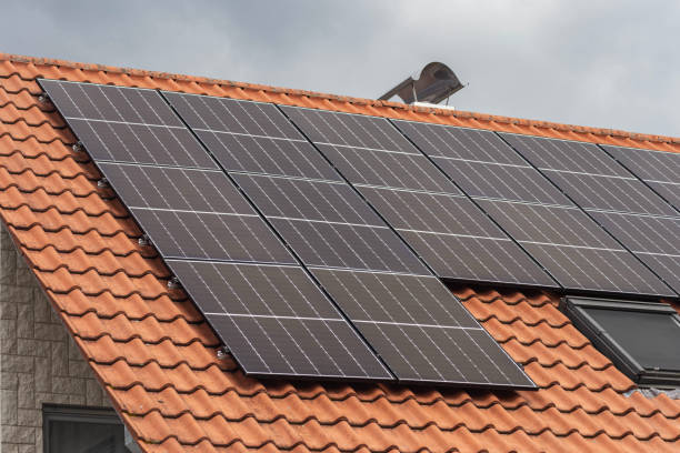 istock new building with solar panel on rooftop and garden green tree bush with cloudy sky weather 1704249984