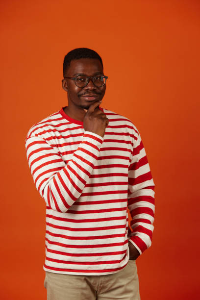 istock Pensive African American man looking at camera thinking 1704251580