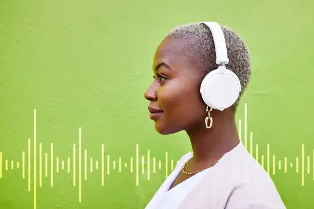 Photo of Radio headphones, profile and black woman listening on green wall background mockup space. Music, audio and African person streaming podcast, overlay and hearing sound of jazz media on technology.