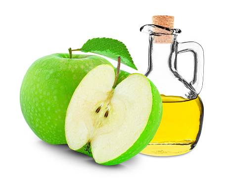 apple oil in bottle isolated on white background