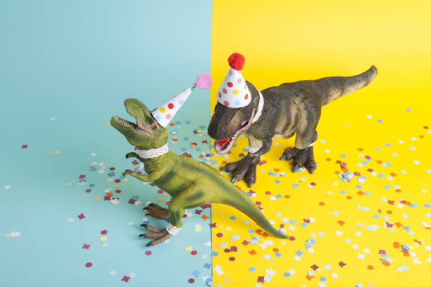 istock a pair of dinosaurs celebrating on a confetti carpet 1704272340
