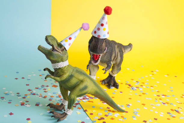 istock a pair of dinosaurs celebrating on a confetti carpet 1704272341