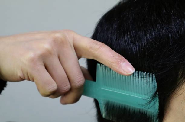 istock Japanese man combing his hair 1704274551