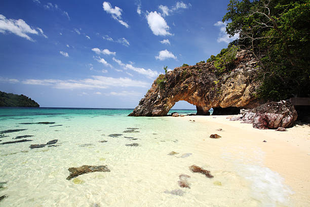 istock Natural stone arch with beautiful beach at Kho Khai 170427928