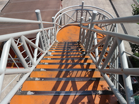 Bridge stairs for people crossing. The steps are orange