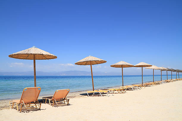 istock Umbrellas and recliners by the sea 170428957