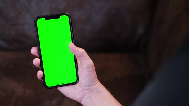 Scrolling, swiping, touching on a green smartphone screen