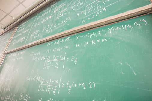 blackboard with complicated  math formulas