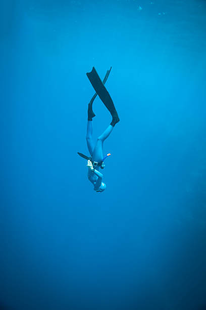 Woman freediving in the ocean More freediving shots: face guard sport photos stock pictures, royalty-free photos & images