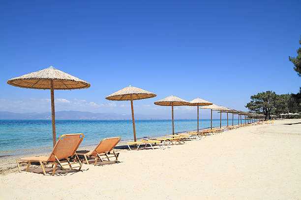 istock Umbrellas and recliners by the sea 170430887