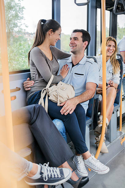 istock Young cheerful couple on bus. 170431556