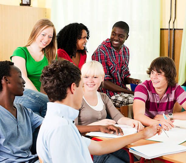 istock Large group of students studying together in the classroom. 170431575