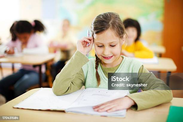 Smiling Girl Sitting In The Classroom Stock Photo - Download Image Now - Book, Boys, Busy