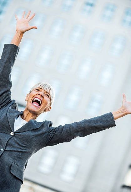 istock Successful businesswoman celebrating her success. 170431781