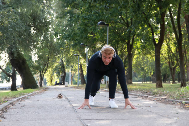 istock Mature man jogging and listen music 1704330968