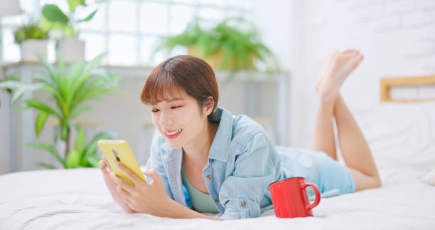 istock woman use mobile phone 1704335977