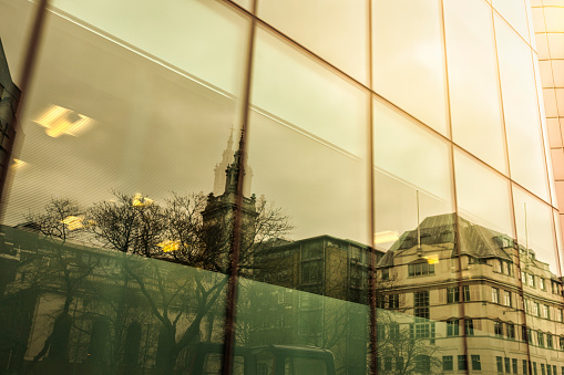 Modern office building in London, windows with reflections
