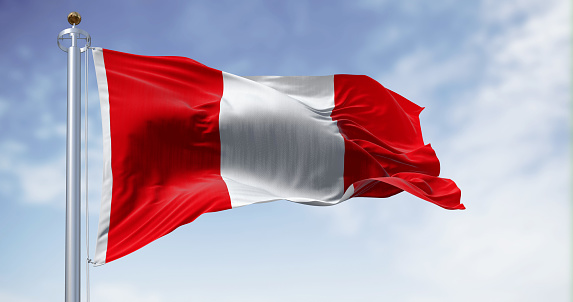 Peru national flag waving in the wind on a clear day. Vertical tri-band consisting of two red outer bands and a single white middle band. 3d illustration render. Fluttering fabric