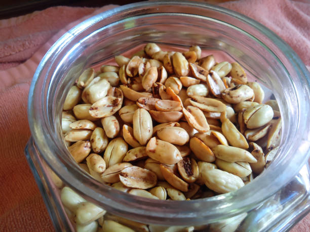 istock close up photo of fried peanuts in a jar 1704358735