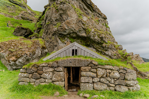Viking house. Picturesque landscape among the mountains of Iceland.