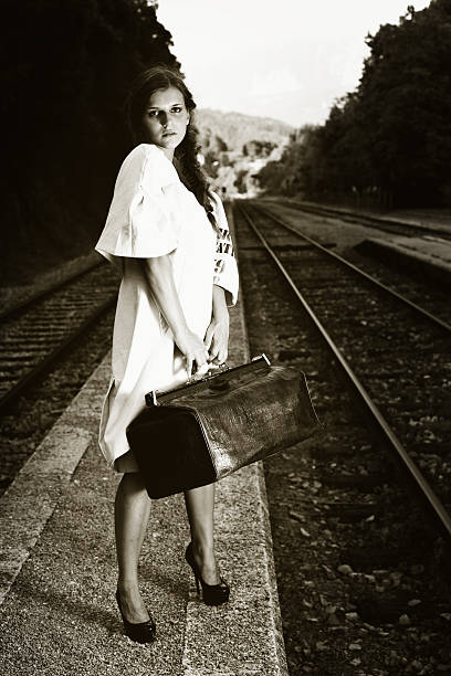 istock Attractive long haired brunette at railway station 170437328