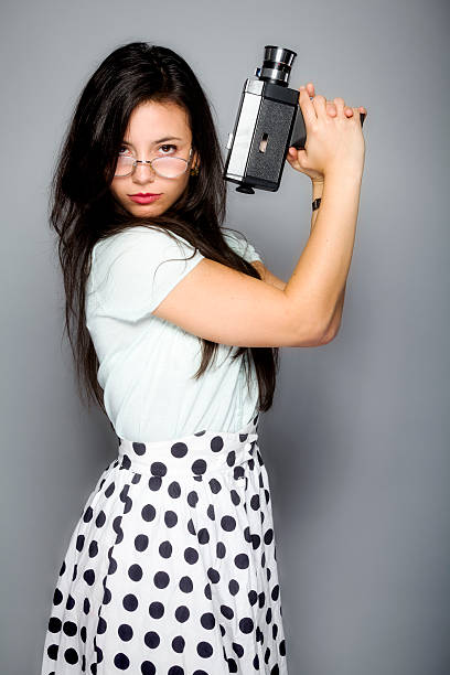 istock Young woman with old camera 170437762