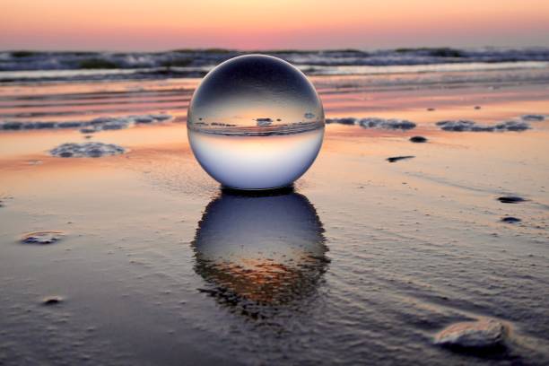istock Crystal ball at beach during dawn 1704382587