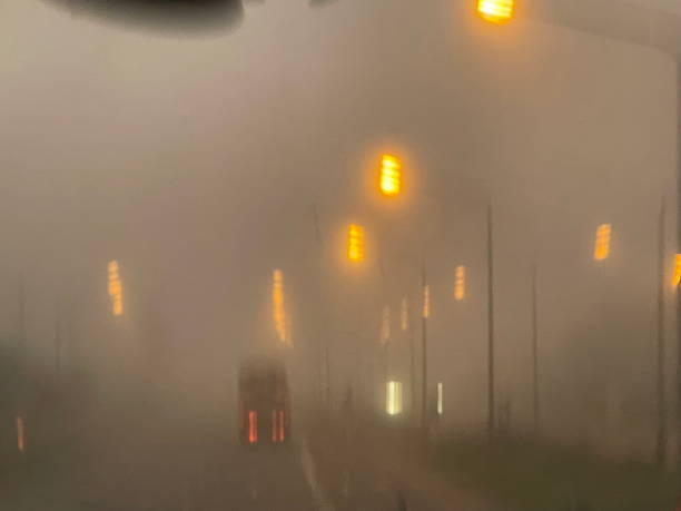 istock Thick fog amidst traffic traveling road 1704390087