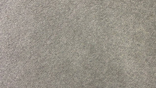 istock Artificial grass surface, rough surface color coarse fibers background 1704390616