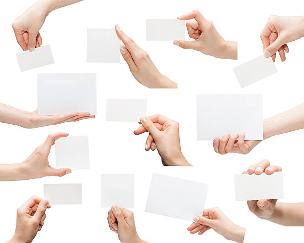 empty business card Collection of blank cards in a hand isolated on white telephone card stock pictures, royalty-free photos & images