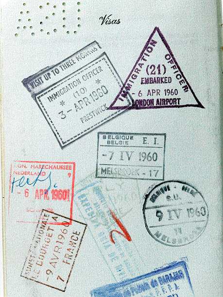 A close up view of vintage passport stamps from the 1960's