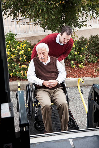 istock Senior man by minibus with wheelchair lift 170440519
