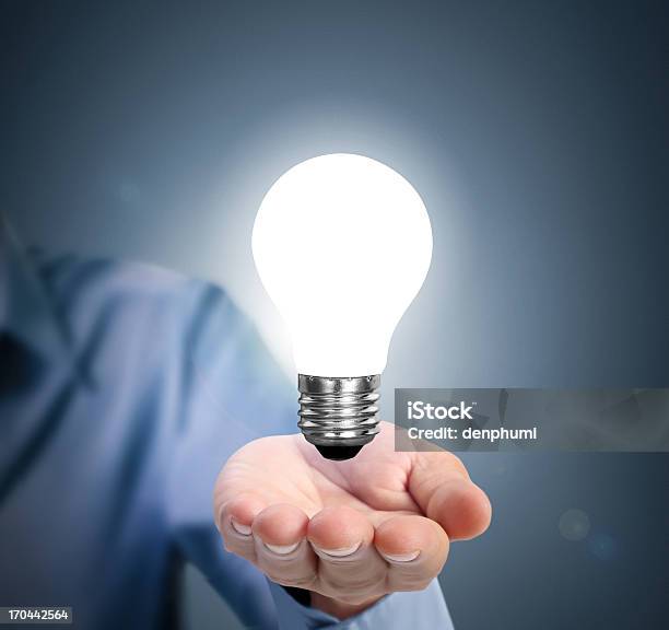 Light Bulb In Hand Stock Photo - Download Image Now - Breaking New Ground, Creativity, Illusion
