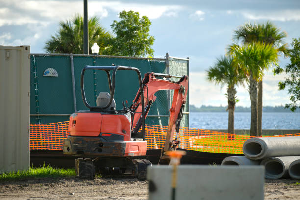 istock Restriction plastic mesh fence at industrial construction site. Protective barrier for pedestrians safety 1704435984