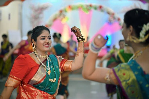istock Women performing traditional Mangala Gaur Dance 1704453579