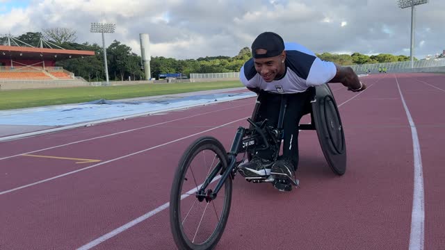 Athlete in wheelchair training on the running track