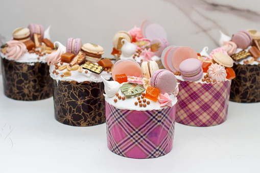 Set of beautiful traditional orthodox cakes decorated with glaze, meringues, chocolate, nuts, toffees, macaroons and jelly