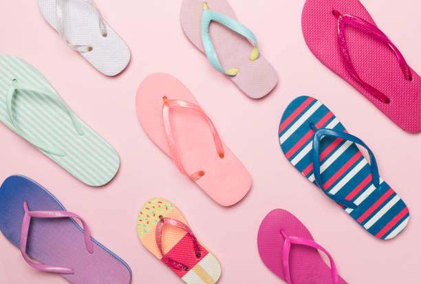 istock Many bright flip flops on color background, top view 1704503228