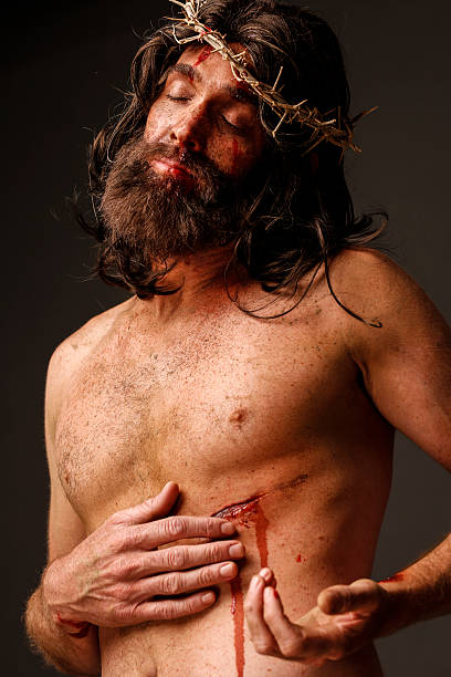 istock Jesus Christ touching his pierced side 170450555