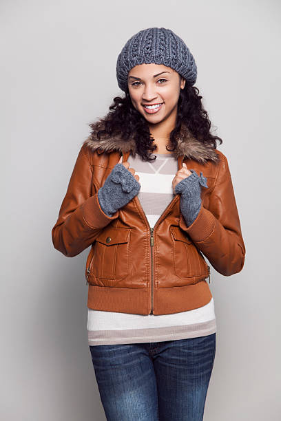 istock Ethnic woman with jacket smiling 170450876